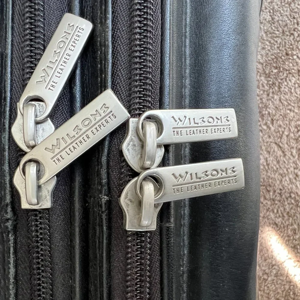 Wilson’s Black Leather Carry on Luggage.